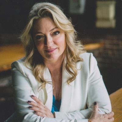 Carole Baskin sitting on a table